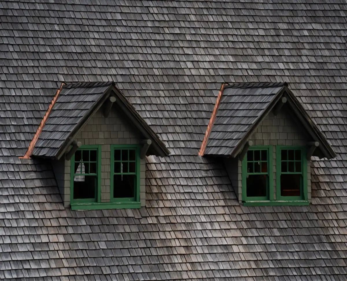 Dormers on a shingle roof in Fresno, CA, where step flashing and kickout flashing carry water past the walls